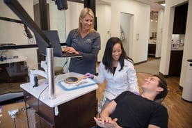 Dr. Melanie Wang and her Registered Dental Assistant, Barbara Whitaker with patient